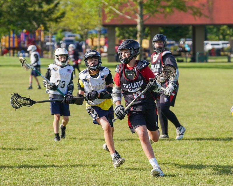Tualatin youth players running upfield during a game